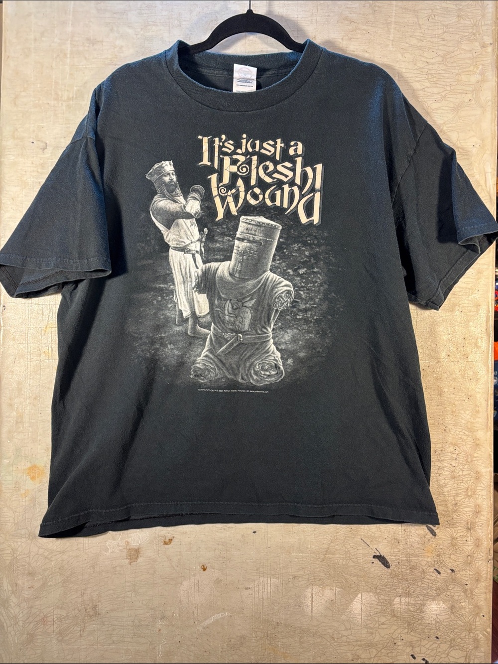 Men's Black Graphic Short Sleeve Tee — 'It's Just a Flesh Wound'